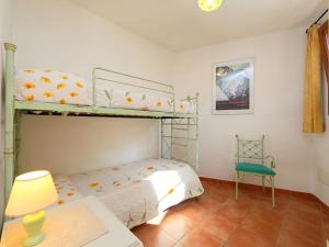 A bed or beds in a room at Villa Petra Rossa by Interhome