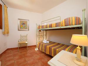 A bed or beds in a room at Villa Petra Rossa by Interhome