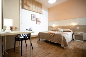 Trapani Home tesisinde bir odada yatak veya yataklar