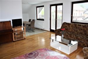 a living room with a couch and a table at 238 Spodnje Gorje in Spodnje Gorje