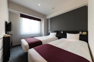 Postel nebo postele na pokoji v ubytování Hotel Villa Fontaine Tokyo-Kayabacho