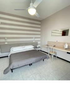 a bedroom with a large bed and a desk at La Casa sul Mare - Monterosso - Cinque Terre in Monterosso al Mare +55 photos