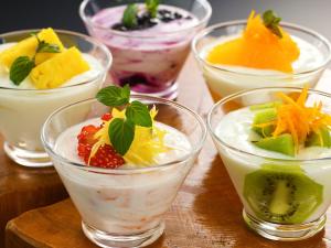 a group of different desserts in glasses on a table at Hotel Ace Morioka in Morioka