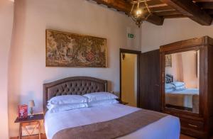 Letto o letti in una camera di Borgo Petroro