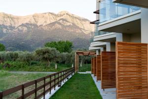 a balcony with a view of the mountains at KYVO Experience in Skala Potamias