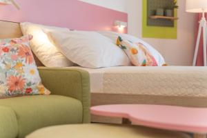 En eller flere senge i et værelse på Apartments Olea