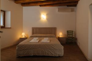 Ένα ή περισσότερα κρεβάτια σε δωμάτιο στο Albergo Diffuso Polcenigo C. Zoldan