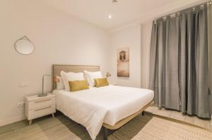 Llit o llits en una habitació de Avenida America en Madrid Capital