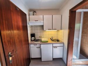 Kuchyň nebo kuchyňský kout v ubytování Gästehaus auf der Höhe