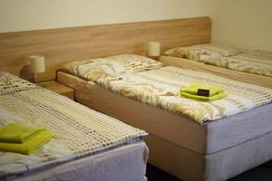 A bed or beds in a room at Hostinec v Zátoce