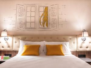 Posteľ alebo postele v izbe v ubytovaní ibis Styles Lublin Stare Miasto