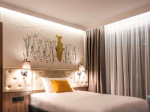 Posteľ alebo postele v izbe v ubytovaní ibis Styles Lublin Stare Miasto