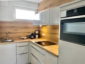 Η κουζίνα ή μικρή κουζίνα στο Bungalow Inselhuus Norddeich