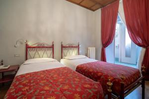 En eller flere senge i et værelse på Hotel Italia