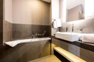 a bathroom with a sink and a mirror at Orazio Palace Hotel in Rome