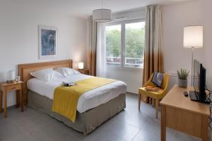 Cama o camas de una habitación en DOMITYS LA BADIANE 5 fotos más