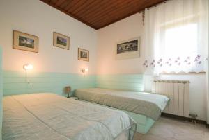 Posteľ alebo postele v izbe v ubytovaní Villa Anna