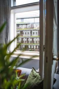 a window with a view of a building at Onefam Old Town in Prague