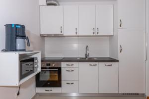 Kuchyň nebo kuchyňský kout v ubytování Apartmani Relax