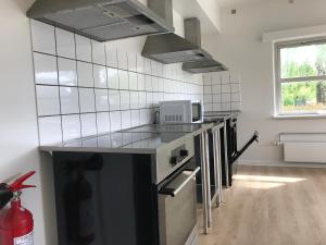 Η κουζίνα ή μικρή κουζίνα στο Djurs Housing