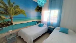 Posteľ alebo postele v izbe v ubytovaní Hawaii Fira Barcelona