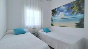 Posteľ alebo postele v izbe v ubytovaní Hawaii Fira Barcelona
