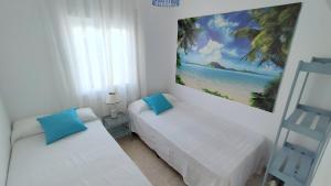 Posteľ alebo postele v izbe v ubytovaní Hawaii Fira Barcelona