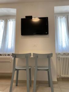 TV a/nebo společenská místnost v ubytování Camere Nicolina 4