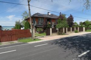 a house on the side of a street at Gránit Villa - freshly renovated in Balatonszárszó