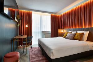 Кровать или кровати в номере The Scott Hotel Brussels