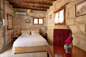 En eller flere senge i et værelse på Cottage Houses