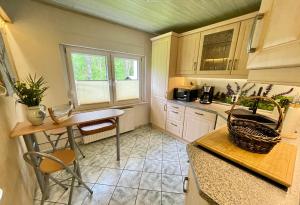 a kitchen with a table and a counter top at Ferienhaus Kurt in Elbingerode
