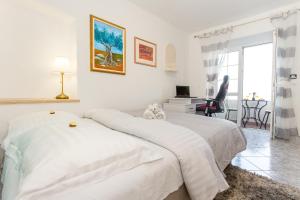 Postel nebo postele na pokoji v ubytování Apartments Tino