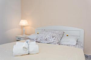 Postel nebo postele na pokoji v ubytování Apartments Tino