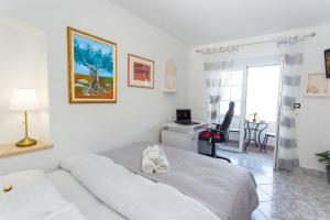 TV a/nebo společenská místnost v ubytování Apartments Tino