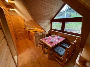 an overhead view of a table and chairs in a cabin at Apartmány SKI Čertovica in Liptovská Sielnica
