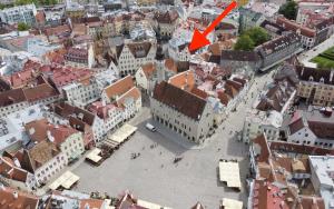 an aerial view of a city with a red arrow at Old Bishop's House in Tallinn