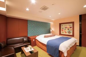 เตียงในห้องที่ Hotel Chapel Sweet (Adult Only)