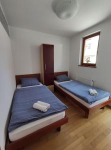 Postel nebo postele na pokoji v ubytování Apartments Bohinjc