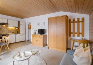 a living room with a couch and a table at Appartements Klausner in Altenmarkt im Pongau