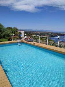 a large swimming pool on top of a cruise ship at Tenuta la Timpa Vela rooms And pool in Acireale