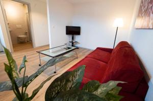 TV a/nebo společenská místnost v ubytování Hôtel Bellavista "Bellevue"