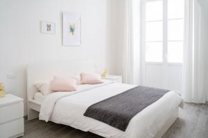 Llit o llits en una habitació de NIU LUX Apartments