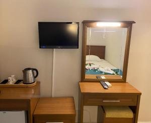 TV/trung tâm giải trí tại B&B Yuzbasi Beach