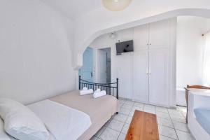 A bed or beds in a room at APOLLON PALACE