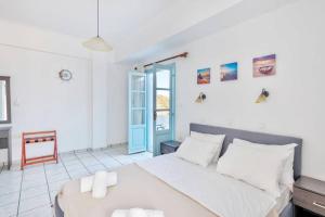 A bed or beds in a room at APOLLON PALACE