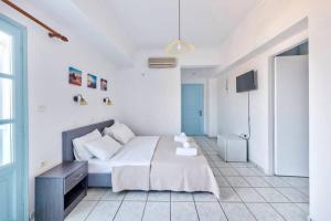 A bed or beds in a room at APOLLON PALACE