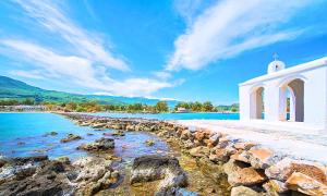 a chapel on the shore of a body of water at Allas Villa Heated Pool in Chania Town +22 photos