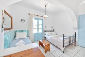 Postel nebo postele na pokoji v ubytování APOLLON PALACE