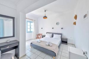 A bed or beds in a room at APOLLON PALACE
